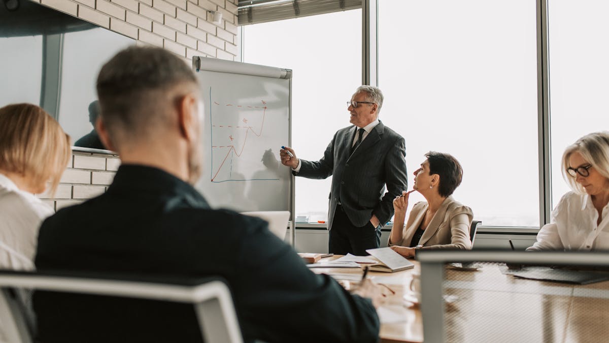 Professionals in a calm boardroom discussion